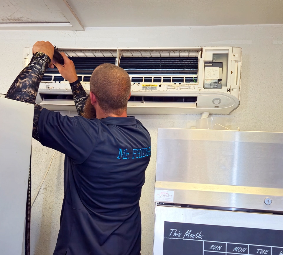 Mr. Fridge is performing a repair on HVAC System in Seattle, WA