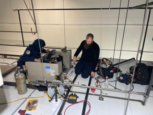 technicians inspecting image