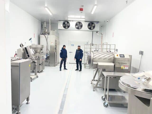 technician working on walk in cooler image
