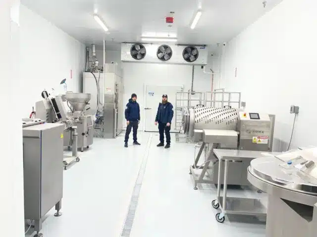 technician working on walk in cooler image